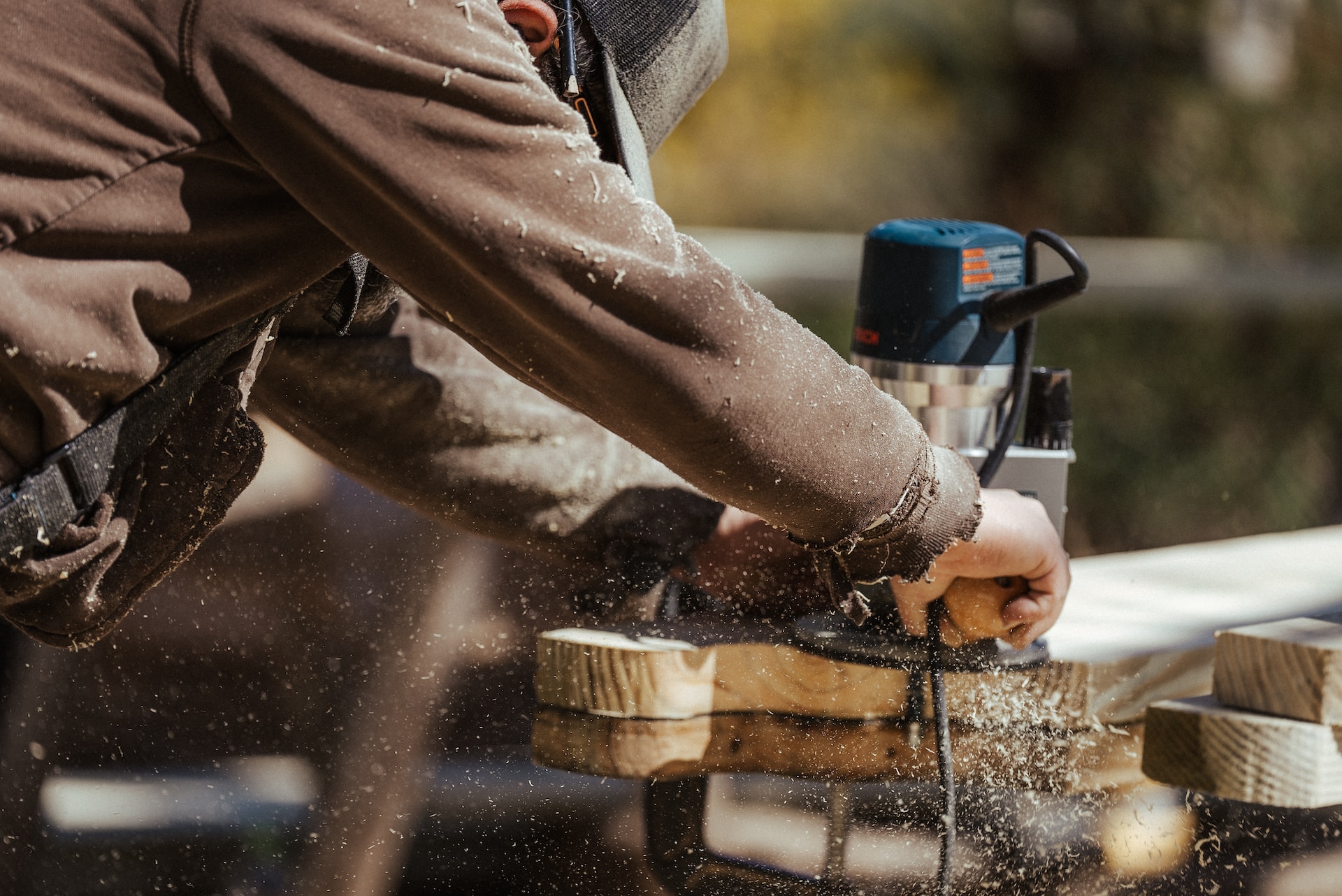 A skilled carpenter expertly operates a circular saw.