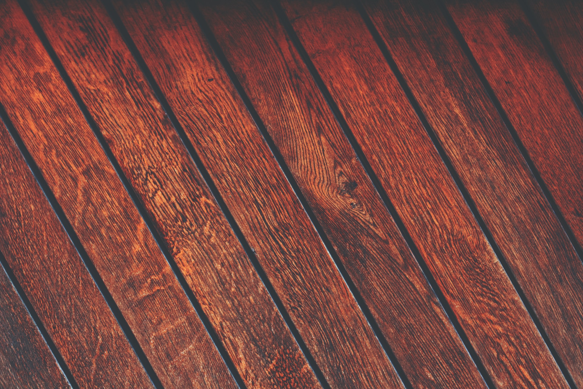 A close-up of a vibrant red wooden wall.