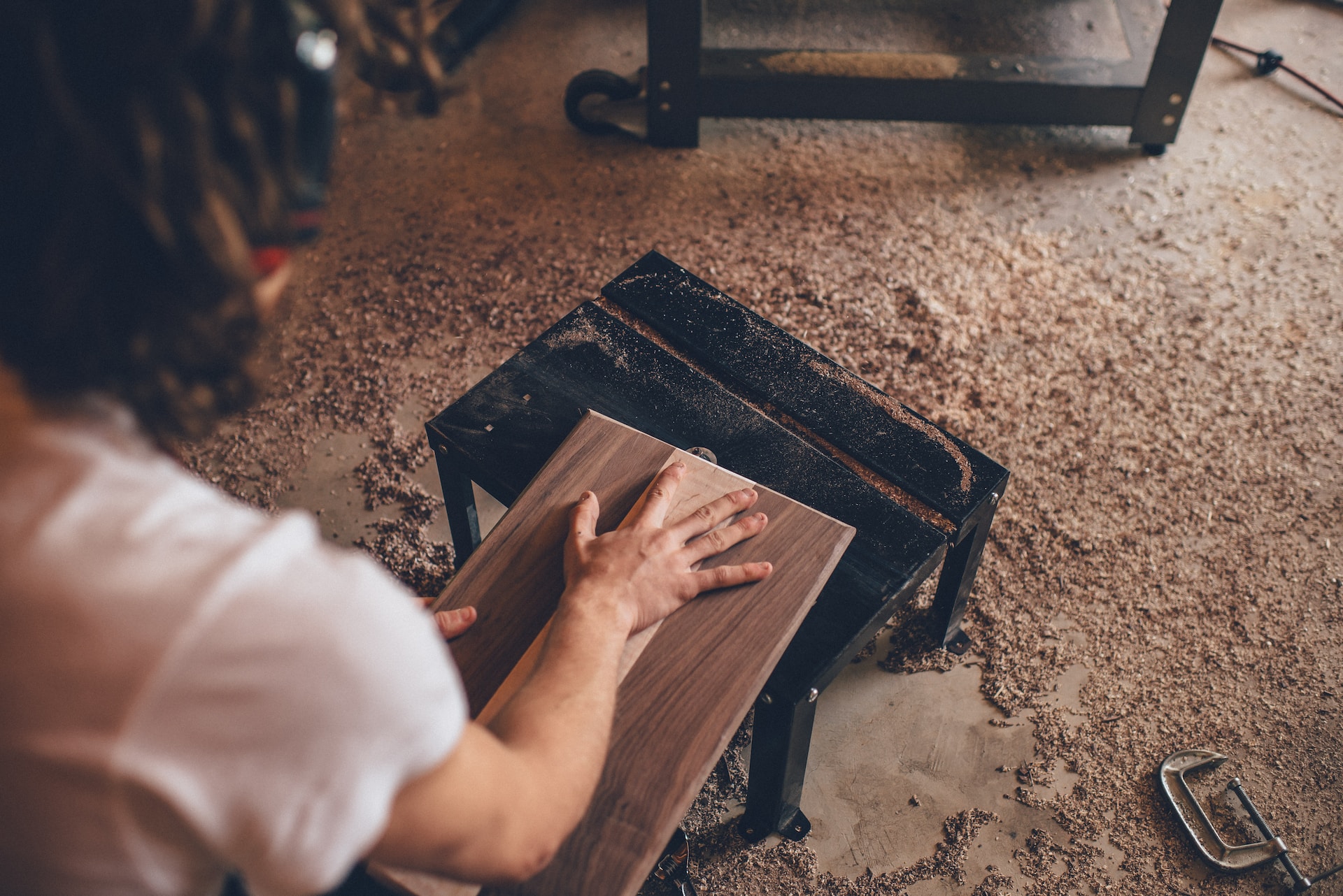 A talented carpenter meticulously shaping a piece of wood.